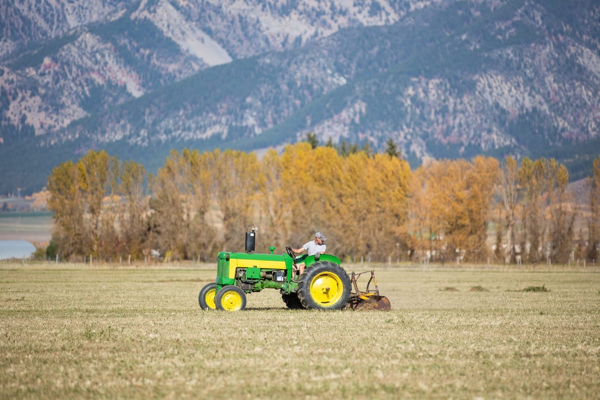 John Deere 435 with mountains